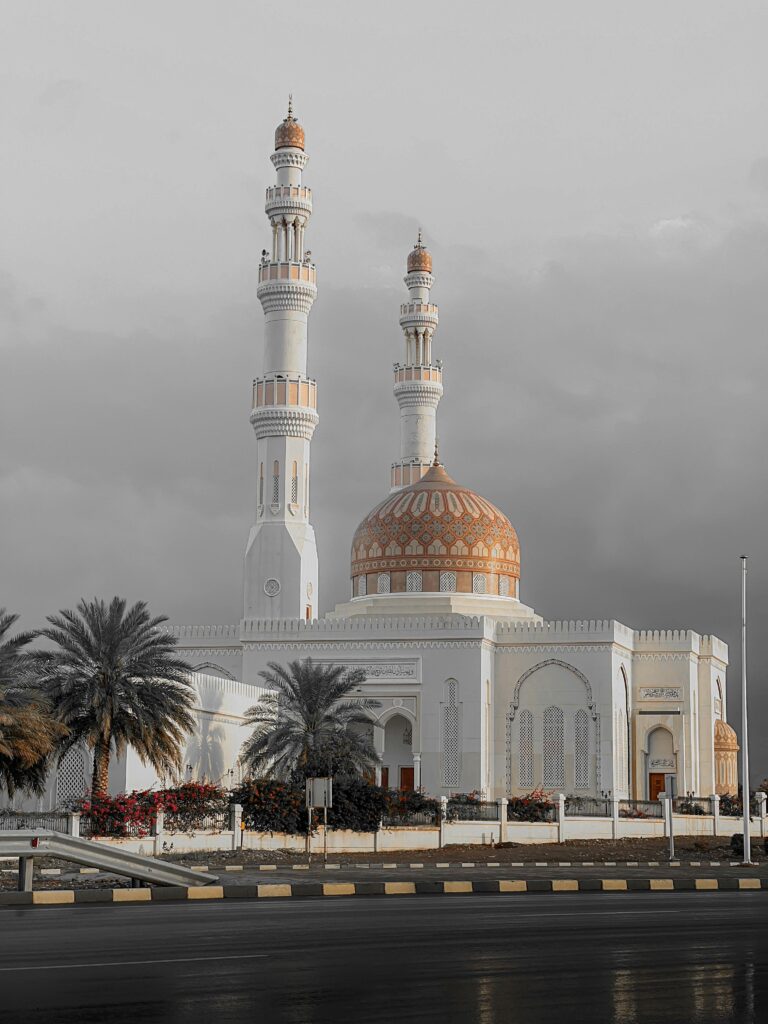 pexels-photo-27307136-27307136 Stunning capture of a mosque in Oman with a distinctive golden dome and towering minarets.